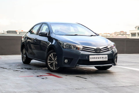 Side profile of pre-owned Toyota Corolla Altis 2015 1.6L CVT, blue color, for sale singapore